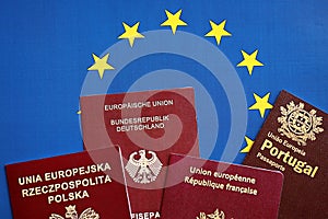 European union countries passports on blue EU flag close up