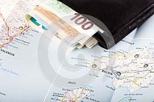 European union currency in a wallet on a map background photo