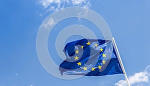 European Union EU flag against a blue sky. Soon there will be one less star since the UK voted to leave the EU in 2016,