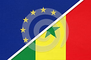 European Union or EU and Senegal national flag from textile. Symbol of the Council of Europe association