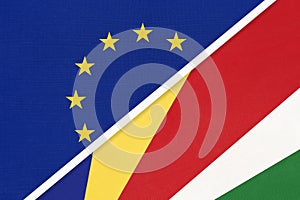 European Union or EU and Seychelles national flag from textile. Symbol of the Council of Europe association