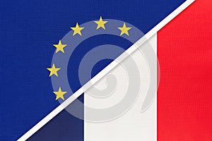 European Union or EU vs France national flag from textile. Symbol of the Council of Europe association