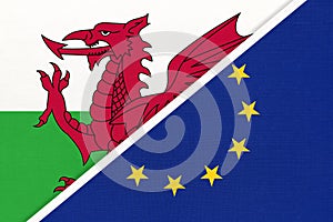 European Union or EU vs Wales national flag from textile. Symbol of the Council of Europe association