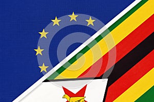 European Union or EU and Zimbabwe national flag from textile. Symbol of the Council of Europe association