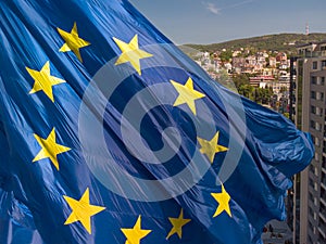 European union flag Against City Varna at summer day, Bulgaria