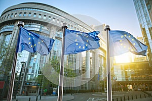 European union flag against parliament in Brussels photo