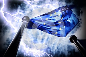 European Union flag on dark thunderstorm sky background