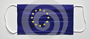 European Union flag. Medical mask, Medical protective mask on a white background.Healthcare and medical concept