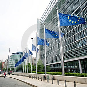 EU flags in front of European Commission building in Brussels