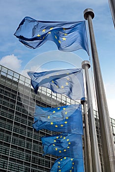 European Union flags in front of the Berlaymont building (European commission) in Brussels, Belgium. photo