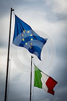 European Union and Italian flags flying together