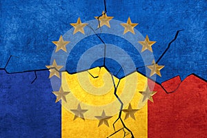 European union and Romanian flags breaking apart