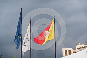 European Union and Sicilian Flags Waving in the Sky of Donnalucata, Scicli, Ragusa, Sicily, Italy