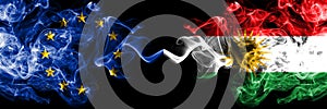 European Union vs Kurdistan, Kurdish smoke flags placed side by side. Thick colored silky smoke flags of EU and Kurdistan, Kurdish