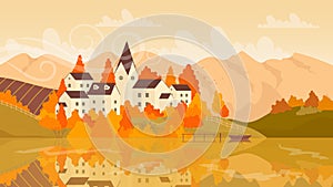 European village on lake in autumn landscape in yellow orange fall colors, small town