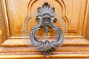 European Vintage old metal wrought iron door knocker. Design detail. Paris