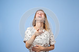 European woman pointing and laughing at you