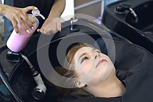 Woman hairdresser in beauty salon cut hair and hair design