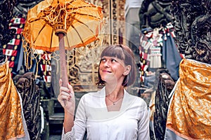 European young woman in balinese traditional temple. Bali island.