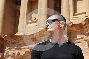 Europian tourist man with sunglasses in Petra in Jordan during a journey