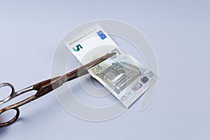 Euros banknote and a scissors