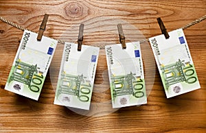 Euros hang on clothes-peg