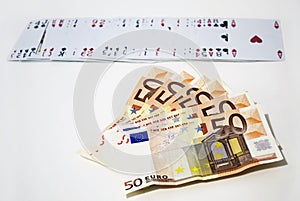 Euros and playing cards, gambling winnings concept