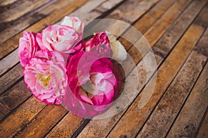 Eustoma lying on a wooden board rustic style