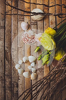 Eustoma and seashells in the shape of heart