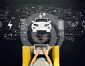EV concept with person using a laptop