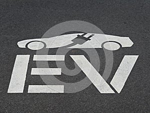 EV Electric Charging Logo on an Asphalt Parking Spot.
