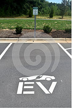 EV Electric Charging Logo and Sign on an Asphalt Parking Spot