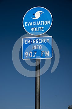 Evacuation route  highway sign  and blue skies