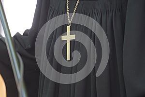 Evangelical pastor wearing a golden cross