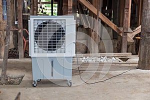 Evaporative Air Cooling Fan. Air conditioning. portable air cooler and humidifier on casters. Mobile air purifier.