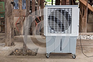 Evaporative Air Cooling Fan. Air conditioning. portable air cooler and humidifier on casters. Mobile air purifier.