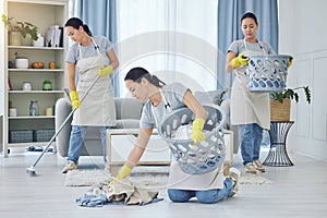 Even three of me cant get this done fast enough. a busy young woman cleaning at home.