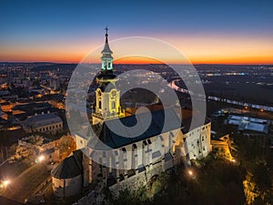 Evening aerial view of Nitra castle during winter with river Nitra