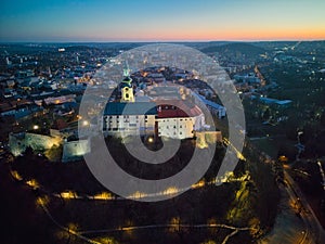 Evening aerial view of Nitra castle during winter with stairway under the castle