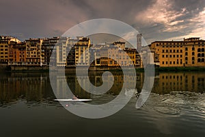 Evening on the Arno River in Florence. City embankments. Italy photo