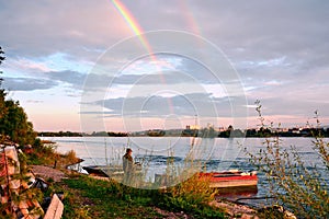 An evening on the banks of the Angara river in Irkutsk city. The view from the Islands of the river. Bright white clouds and rainb