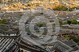 Evening bird eye view of local historical architecture roof building of Old Town of Lijiang in Yunnan, China