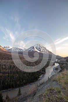 Evening blue sky over Matanuska River flowing past Chugach Mountains near Palmer Alaska USA