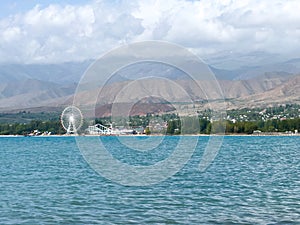 Evening calm and smooth lake surface under soft clouds