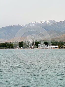Evening calm and smooth lake surface under soft clouds