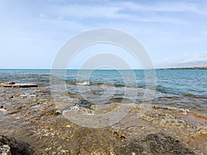 Evening calm and smooth lake surface under soft clouds