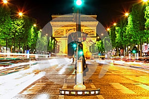 Evening on Champs-Elysees in front of Arc de Triomphe.Paris. France.