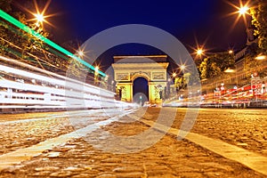 Evening on Champs-Elysees in front of Arc de Triomphe.Paris. France.