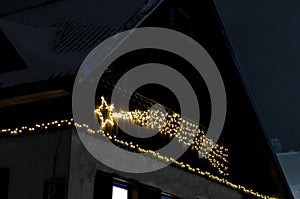 the evening before Christmas cottages. windows and lamps let in a warm