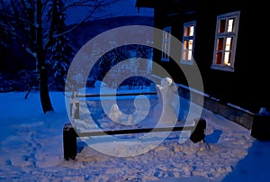 the evening before Christmas cottages. windows and lamps let in a warm